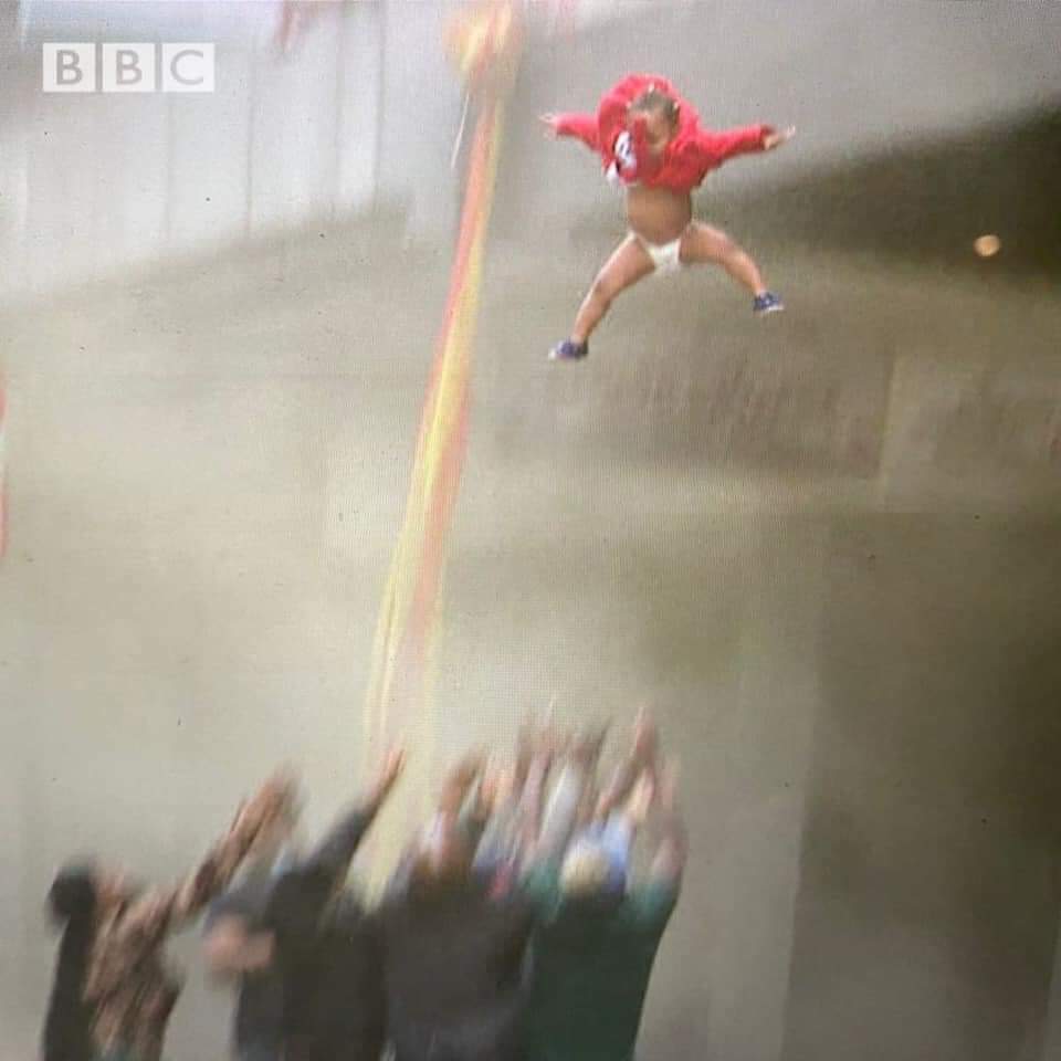 Watch The Moment Mother Threw Her Baby Off A Building After It Was Set Ablaze By Looters In SA (Video)