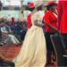 Drama As Woman Looking For Husband Wears Wedding Dress To Church (PHOTO)