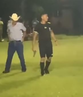 Drama As Referee Pulls Gun Out To Restore Order After Controversial Penalty Call Angered Fans (Photos)