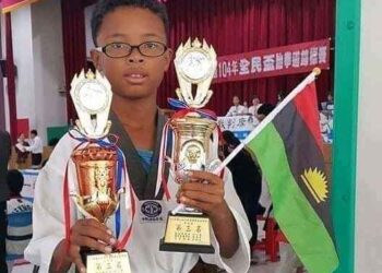 Nigerian Boy Celebrates With Biafran Flag As He Emerges Taekwondo Champion In China (See Photos & Comments)