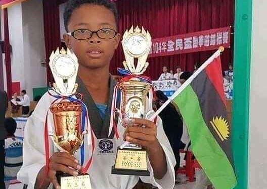 Nigerian Boy Celebrates With Biafran Flag As He Emerges Taekwondo Champion In China (See Photos & Comments)