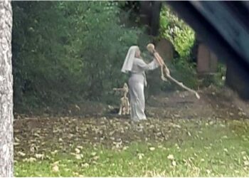 Shock As Woman Who Is Dressed As A Nun Is Seen Dancing With Skeletons In Graveyard (Photos)