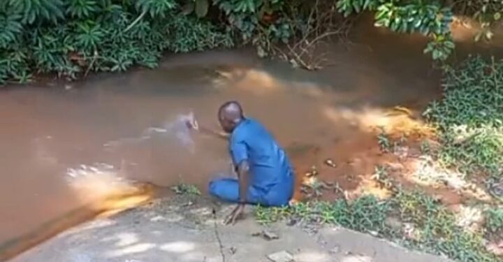 Man Prays Against Evil Nigerian Leaders, Takes Case To His Village Stream (Video)