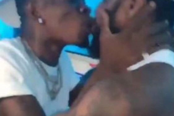 Mixed Reaction As Shatta Wale Is Spotted Kissing His Male Security Guard On The Mouth After Gifting A Diamond Neck Chain (Video)