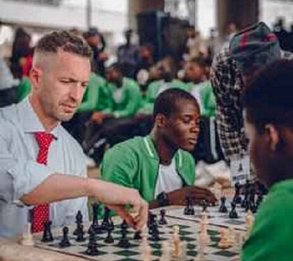 Jubilation As Nigerian Boy Defeats Canadian High Commissioner In Chess Game Under Oshodi Bridge (Photos & Video)