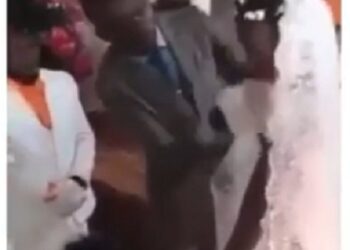 See The Embarrassing Moment Pastor Wiped off Bride & Bridesmaid’s Makeup On The Altar With A Cloth (Video)