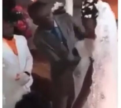 See The Embarrassing Moment Pastor Wiped off Bride & Bridesmaid’s Makeup On The Altar With A Cloth (Video)