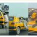 “Lagos Is Not For The Weak” – Reactions As Two Men Cling To Moving Car In Order To Settle Score With The Driver (Video)