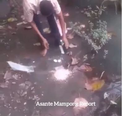 Police Places Curses On His Commander And Two Others By Pouring Libation And Performing Rituals By A River Side (Video)