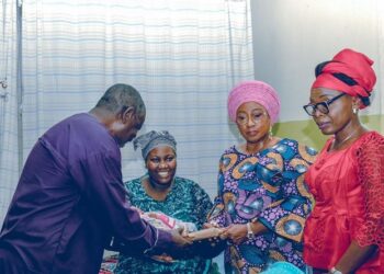 See Photos Of Ekiti First Lady Visiting The Triplets Born To 71-Year-Old Retired Anglican Priest