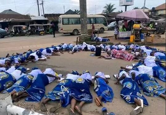 Group Of Church Women Seen Lying On The Road In Umuahia Praying To God For Good Leaders (Video)