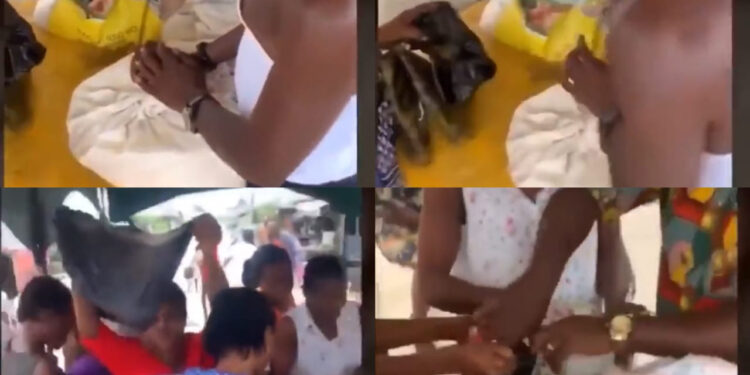 See The Trending Video Of Flood Victims In Bayelsa State Given A Cup Of Rice As Relief Material (Video)