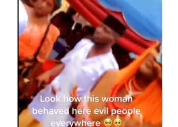 Woman Spotted Scrubbing A Bride’s Face With Money (Video)