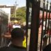 Naira Scarcity: The Moment Some Angry Abuja Residents Forcefully Unlocked Gate Of A Bank (Video)