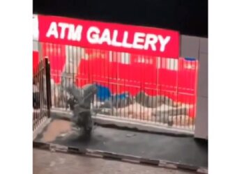 Customers Seen Passing Night At An ATM Booth As Cash Shortage Continues (Video)