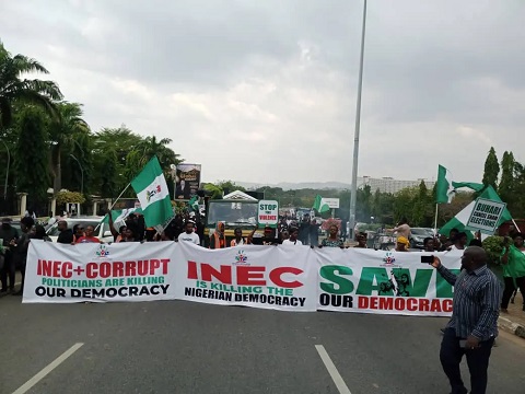 “INEC-Chairman-Must-Go” – Protesters Defy Afternoon Rains, Storm Appeal Court (Photo)