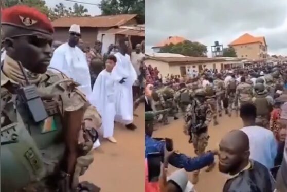 See Trending Footage Of Interim President of Guinea, Mamady Doumbouya Being Guided By Heavily Armed Military Men While Taking A Walk With His Sons (Video)