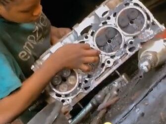 Young Nigerian Girl Seen Fixing Engine At Mechanic Workshop (Video)