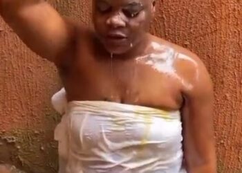 Nigerian Woman Bathes Herself With Crate Of Eggs While Praying To Find ‘True Love’ (Video)