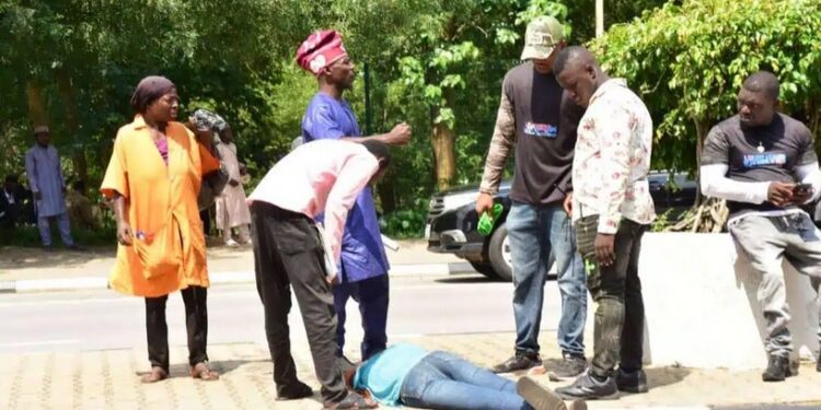 Lady Collapses At Solidarity Venue As Tribunal Delivers Judgement (Photos)