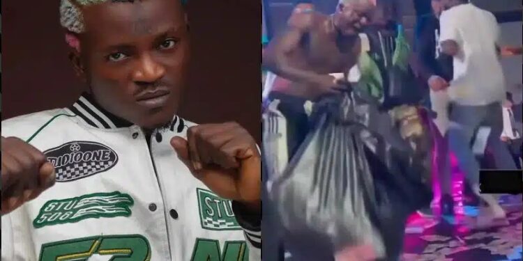 Portable Flaunts Money Sprayed On Him At A Club In Russia (Video)