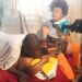 Lady Conducts Ritual On Lovers Stuck Together After Being Caught By ‘Magun’ (Video)