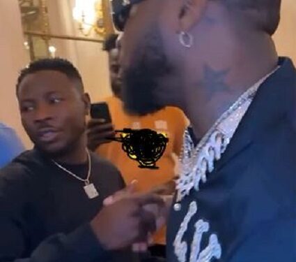 Nigerians React To Davido’s Unusual Handshake With A Man In Black (Video)
