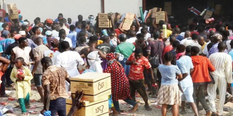 Hardship: Residents Break Into Government’s Warehouse in Abuja, Loot Foodstuffs, Others