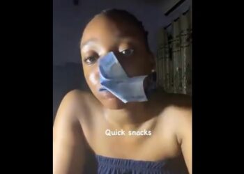 Is This Not Naira Mutilation? – Mixed Reactions As Lady Chews Naira Notes (Video)