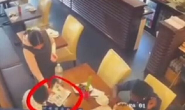 Nigerian Man Shares CCTV Footage Showing Moment Woman Stole His Friend’s Phone In A UK Restaurant (Video)