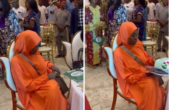 Activist, Aisha Yesufu, Refuses To Stand Up During The Recitation Of The New National Anthem At An Event (Video)