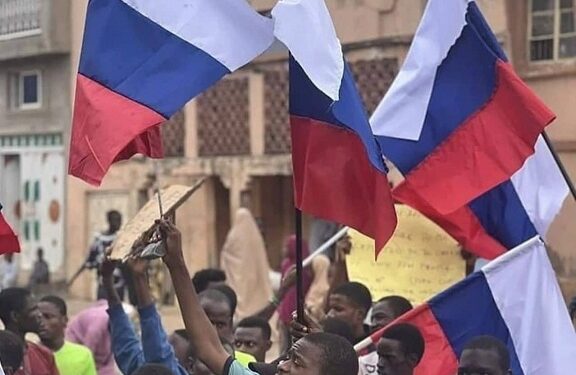 Russia Reacts As #EndBadGovernance Protesters Wave Russian Flag