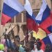 Russia Reacts As #EndBadGovernance Protesters Wave Russian Flag