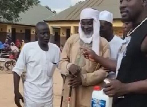 Drama As VeryDarkMan Storms Disability Home, Puts Prophet Fufeyin’s Holy Water To The Test (Video)