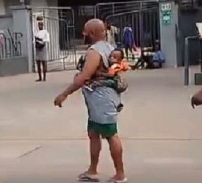 Man Spotted Backing His Baby While Running Errand (Video)