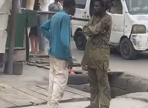 Two Mentally Challenged Men Spotted Having A Discussion In The Middle Of A Street (Video)