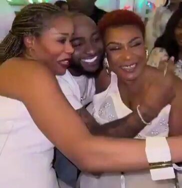 Davido Warmly Greets Burna Boy’s Mother at Tony Elumelu’s All-White Christmas Party (Video)