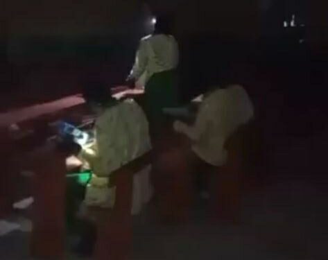 Outrage As Students Sit For WAEC Exam At Night With Torch Light In Asaba (Video)