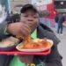 Nigerian Man Faces Backlash For Eating Pounded Yam With Bare Hands On London Bridge (Video)
