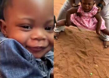 Drama As Baby Girl Refuses To Walk On The Ground During First Visit to Nigeria (Video)